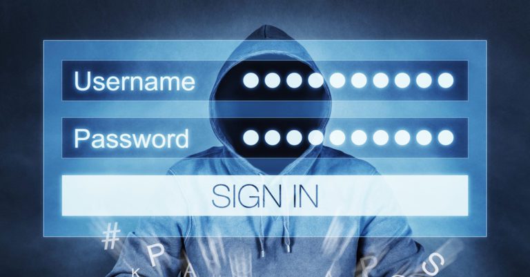2020 election cybersecurity fears represented by a man in a hoodie is shown with a login screen superimposed to represent passwords for sale on the Dark Web