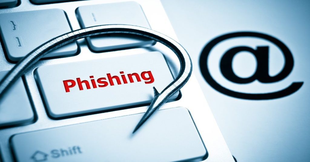 protect trade secrets from cybercriminals represebted by a fish hook on a computer keyboard