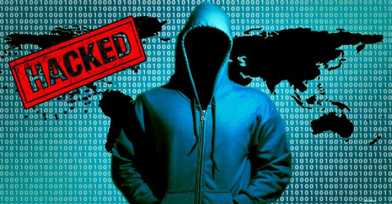 nation-state federal hack phishing described by a man in a hoodie sillohuettes adgains a world map with "hacked" stamped on it